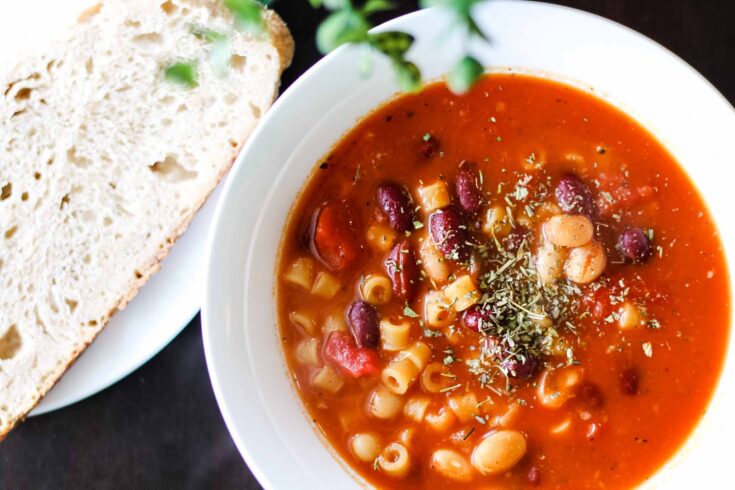 bowl of fagioli soup with sourdough bread