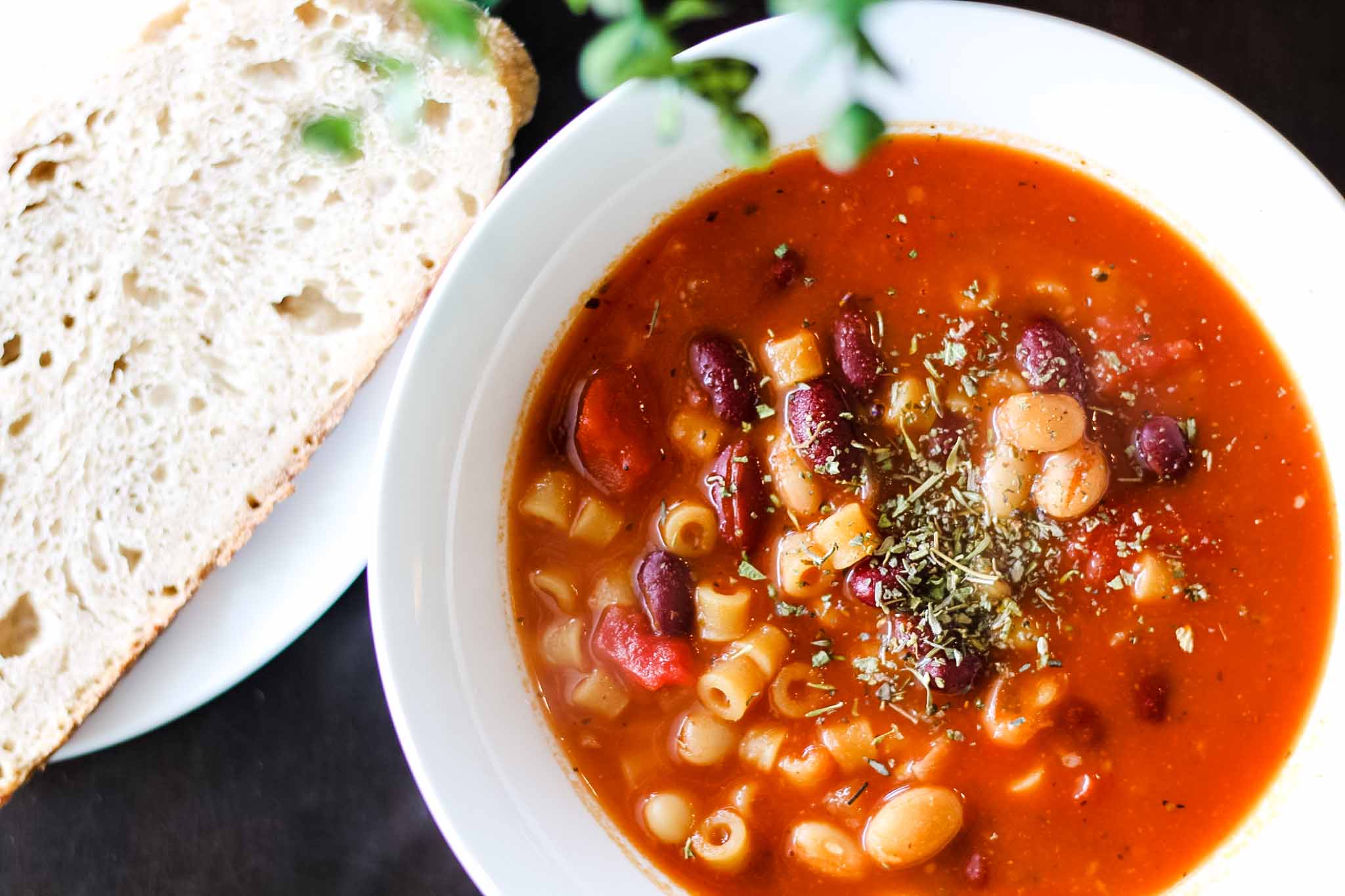 bowl of fagioli soup with sourdough bread